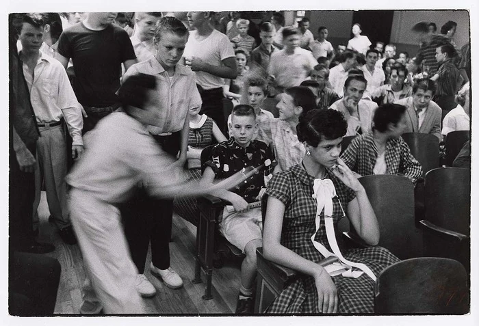 Dorothy Counts in a Harding High classroom in 1957. The International Center of Photography describes the scene as hostile taunting. Photograph by Stan Wayman.