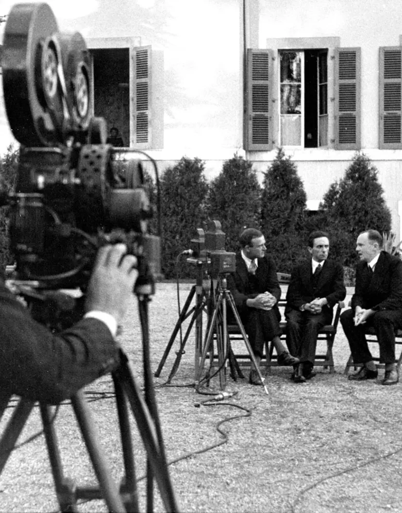 Goebbels stands between two unidentified men in the hotel garden before the radio address. Photograph by Alfred Eisenstaedt.