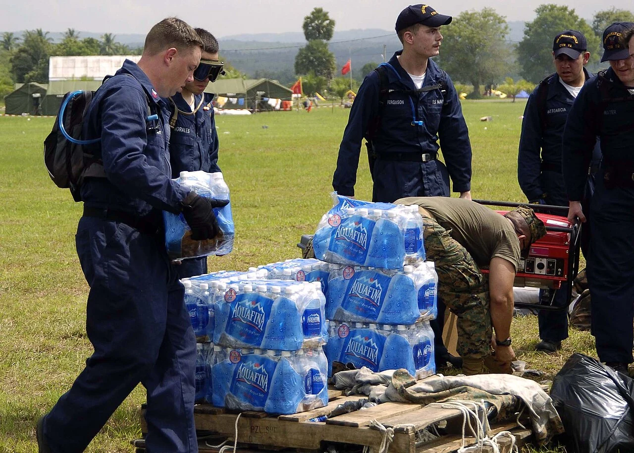 Sailors prepare bottled water for distribution. Aceh, 3 January 2005.