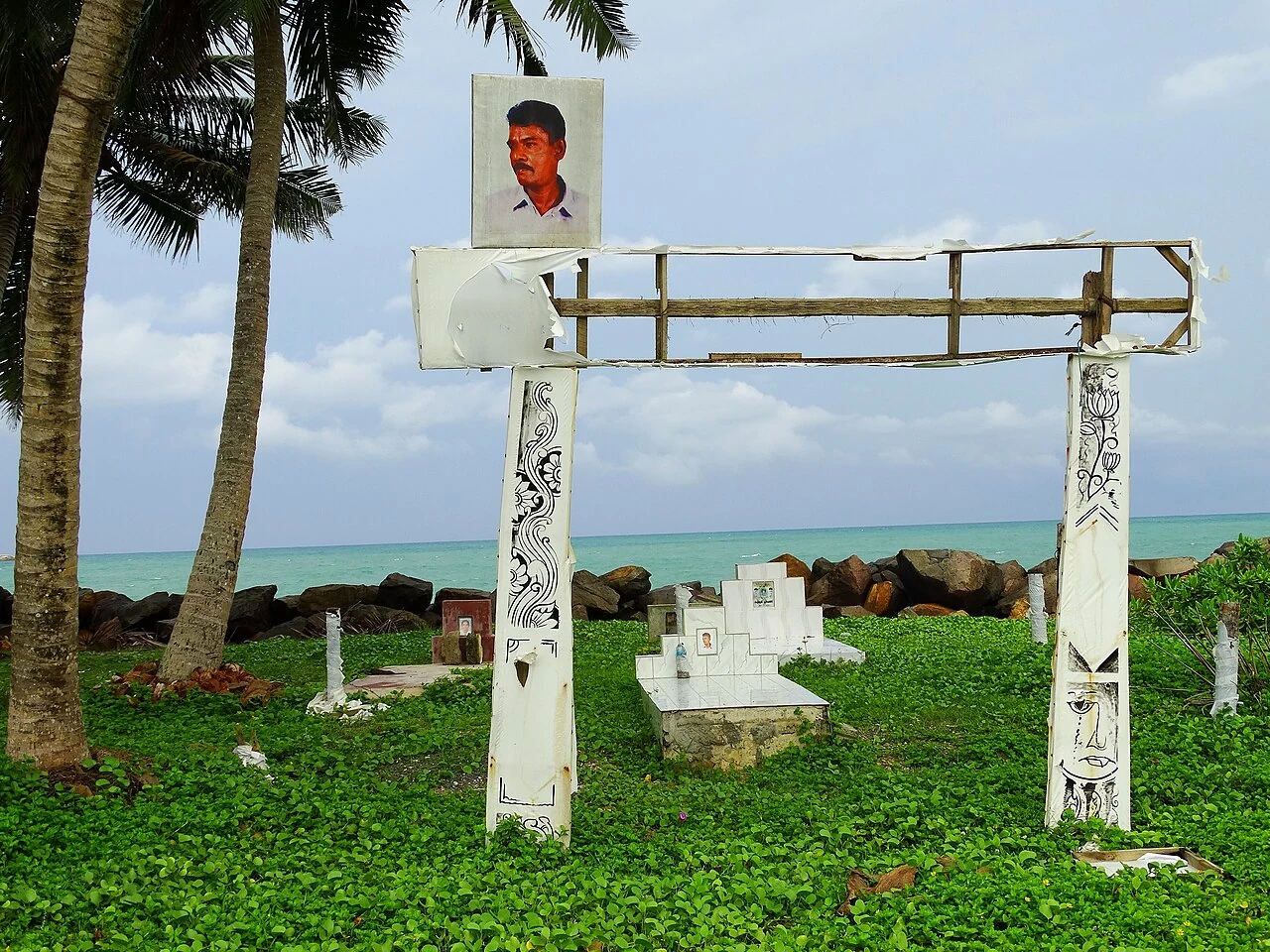 Graves and a tsunami memorial at Peraliya, Sri Lanka. Later photograph, 30 April 2014.