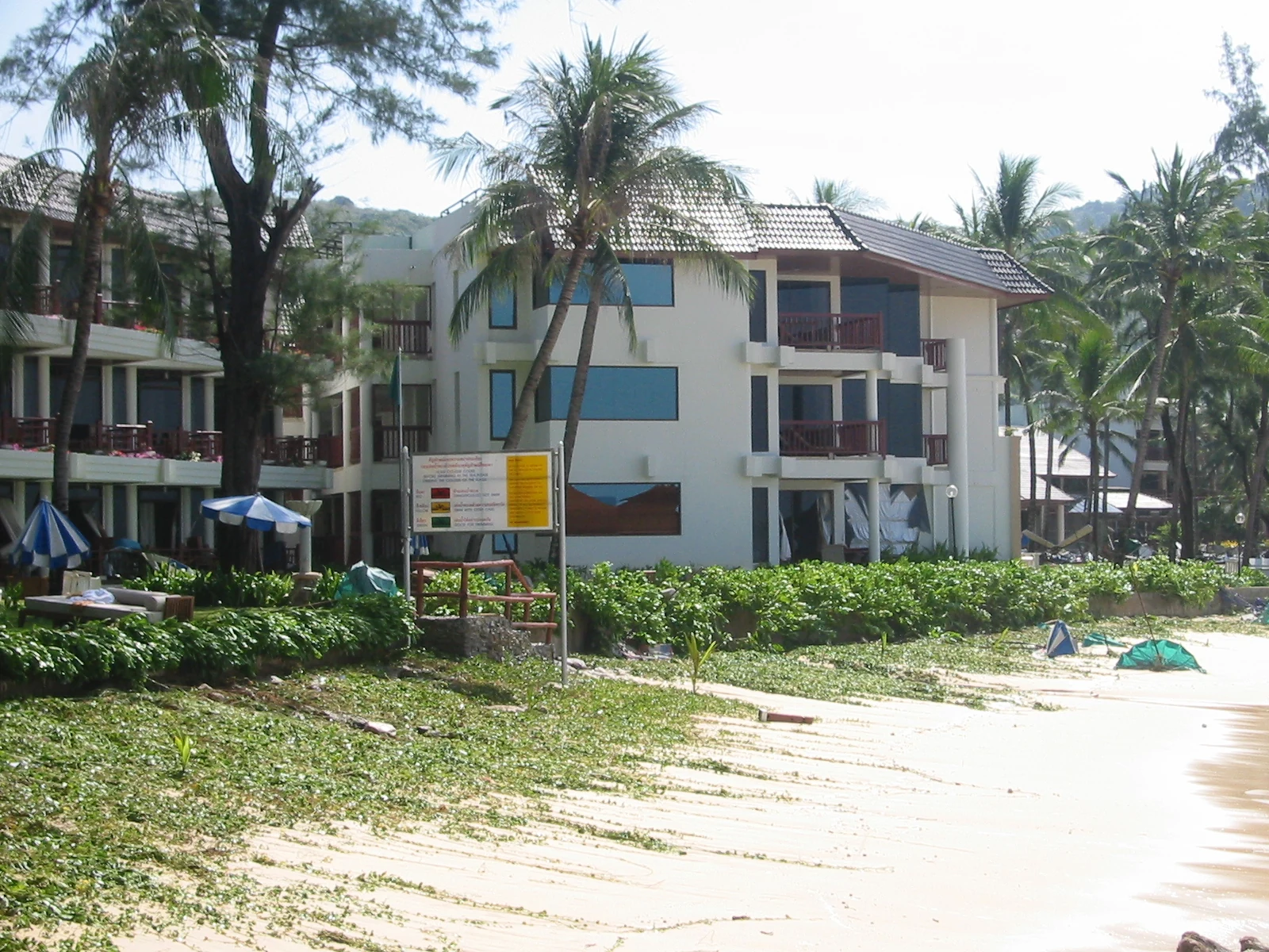 Damaged rooms beside Kata Noi beach. The photographer identifies the aftermath of the third wave, 26 December 2004.