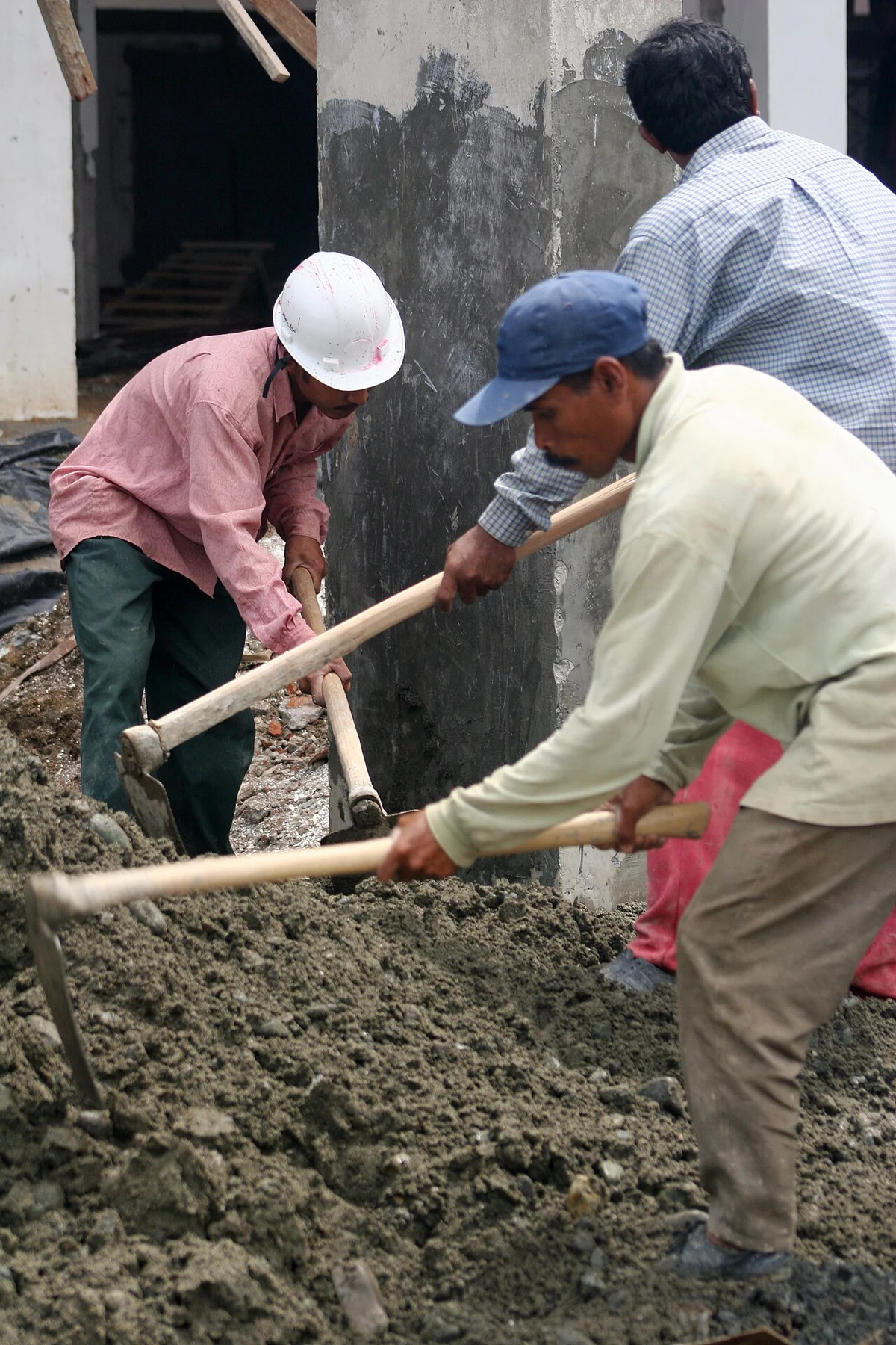 Work at a housing-reconstruction site in Aceh. Indonesia; file metadata gives 11 October 2005.