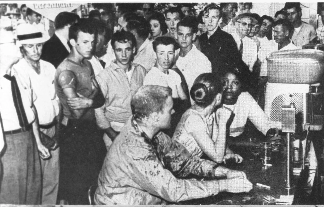 Protesters at Woolworth’s in Jackson are doused with mustard and other food. Photograph by Fred Blackwell, Jackson Daily News / University of Southern Mississippi Libraries.