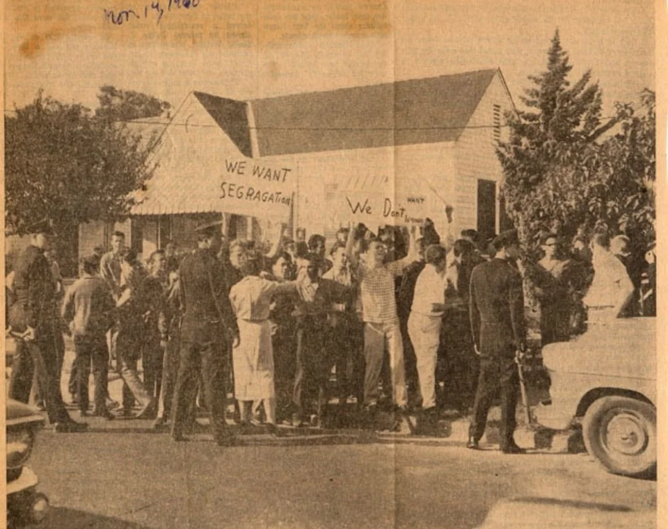 Police hold back opponents of integration outside the school. Ruby is not visible in this picture. New Orleans, 14 November 1960, according to the newspaper reproduction and Amistad Research Center.
