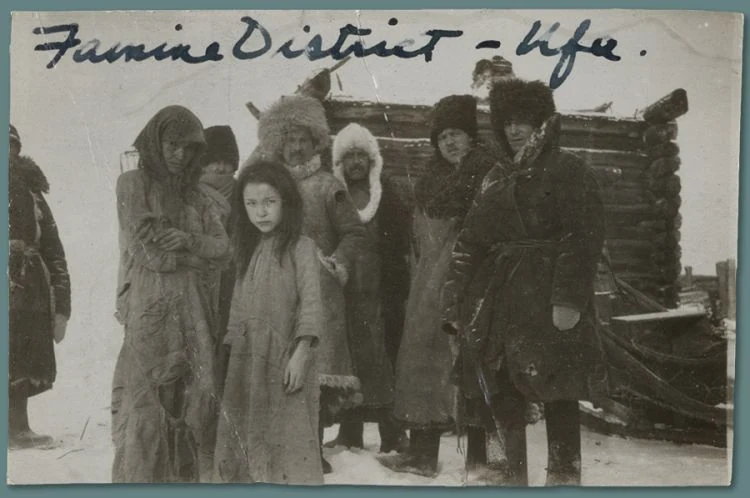Women and children in a famine district. The archival caption places them at Ufa in winter 1922 and identifies them as Bashkirs.