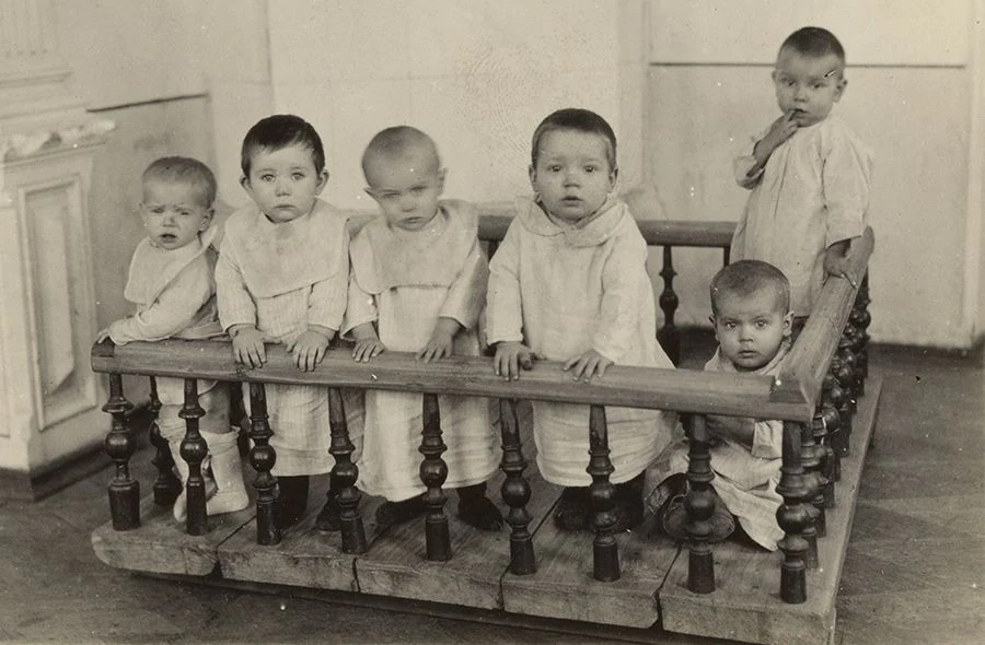 Six children around a cot at the Blandy Children’s Home, 1923.