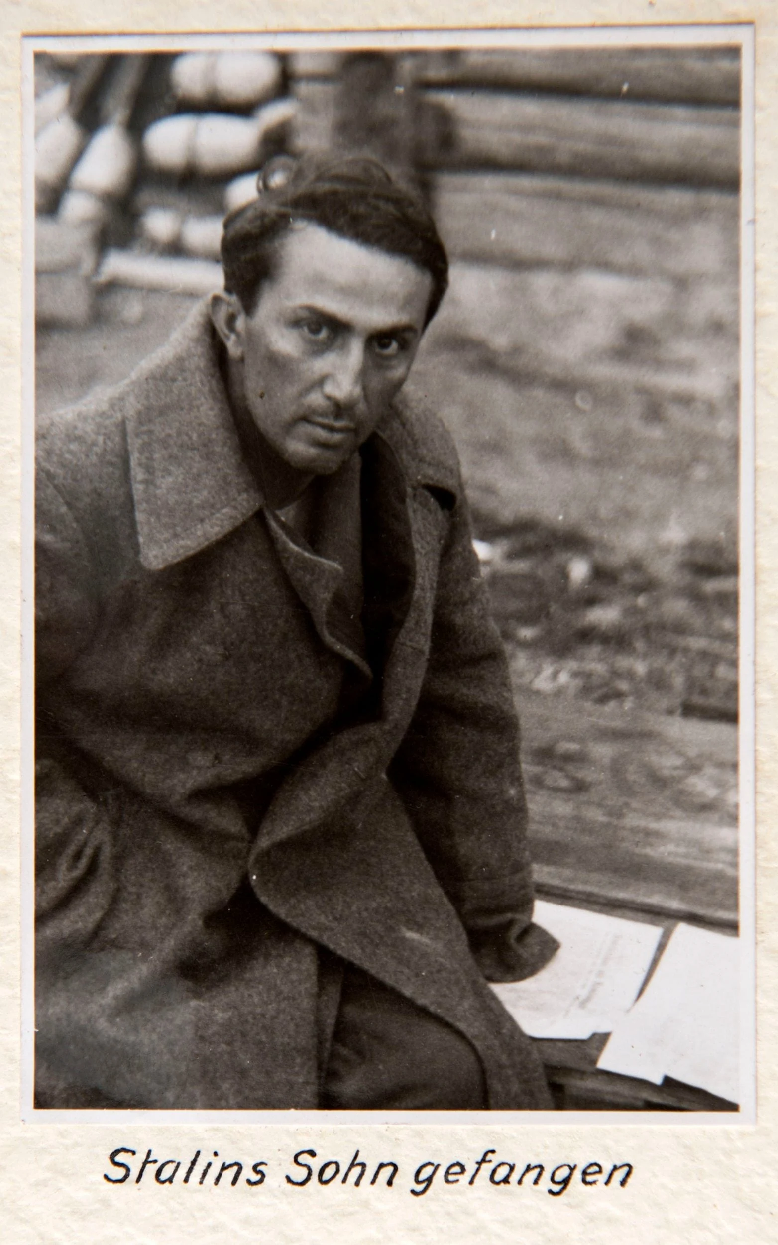 Dzhugashvili faces the camera; the printed caption identifies him as Stalin’s son and announces his capture. Wikimedia Commons attributes the picture to Wolfram von Richthofen but does not explain its circumstances.