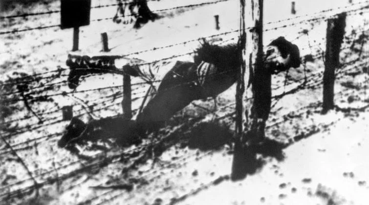 Dzhugashvili’s body beside the fence at Sachsenhausen. The image entered the German file on his death on 14 April 1943. Camp guards said a sentry shot him.